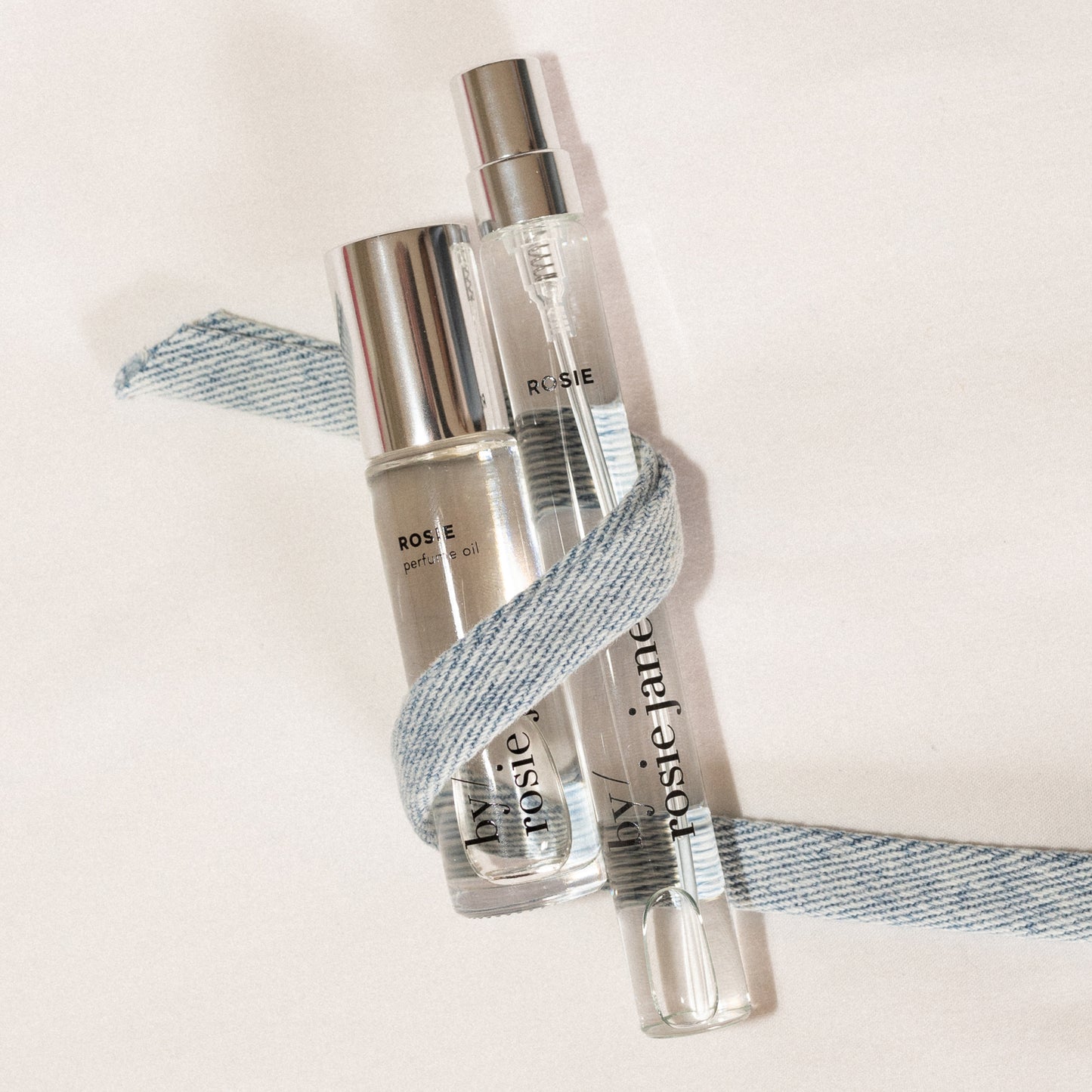 perfume oil and travel spray with a ribbon