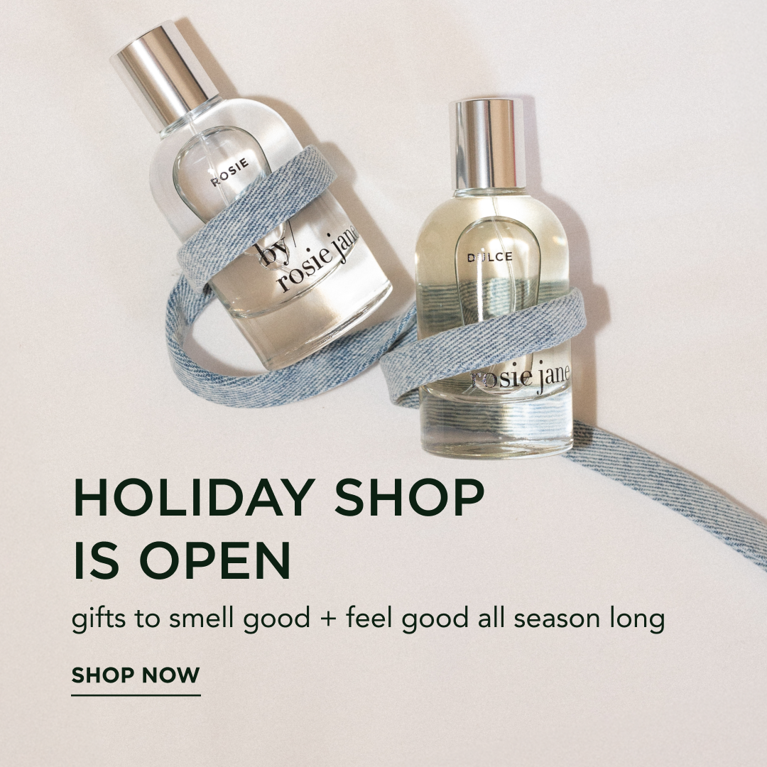 holiday shop is open! two perfume bottles with ribbons and text promoting a holiday shopping season.