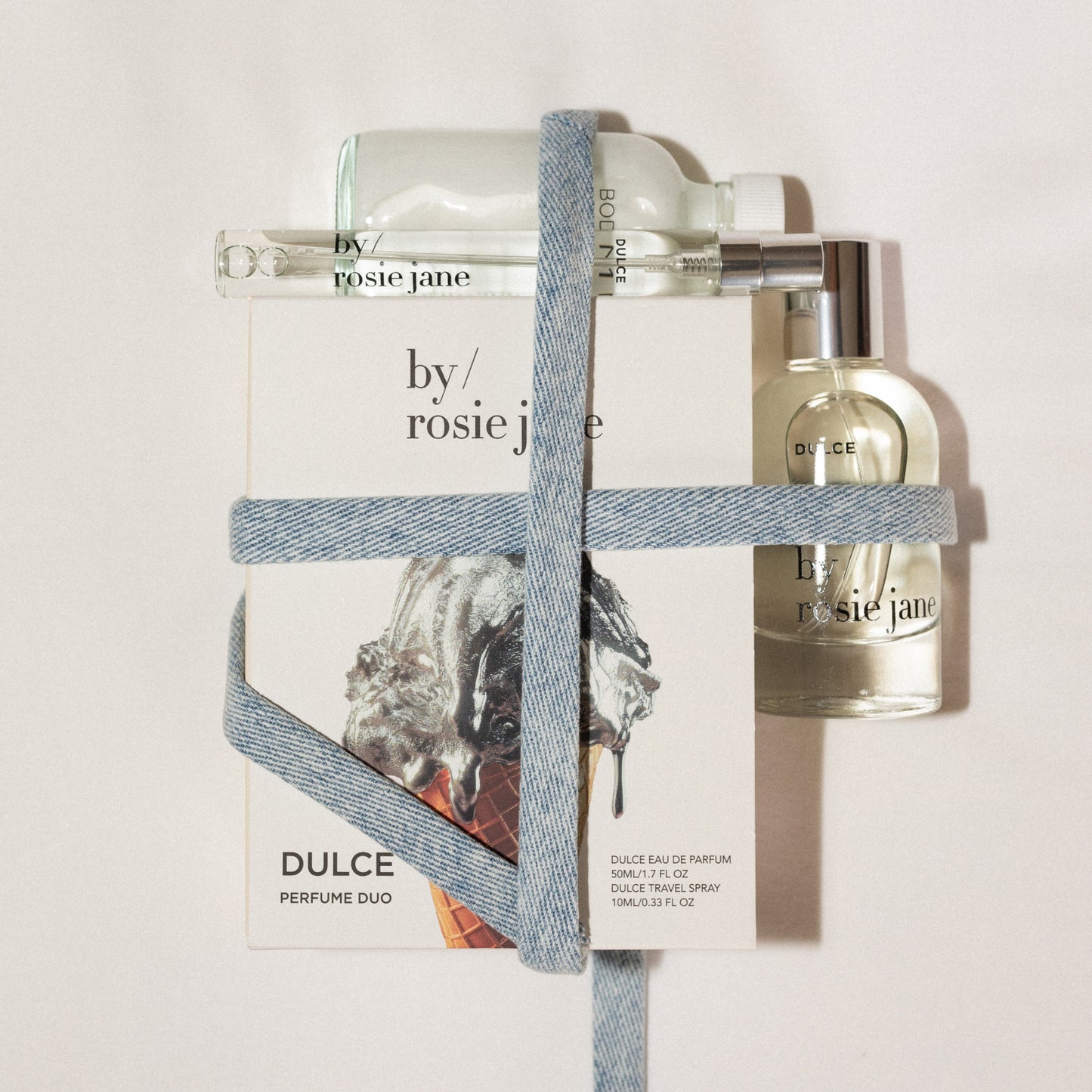 Perfume duo DULCE packaging with 'by rosie jane' branding on a light background