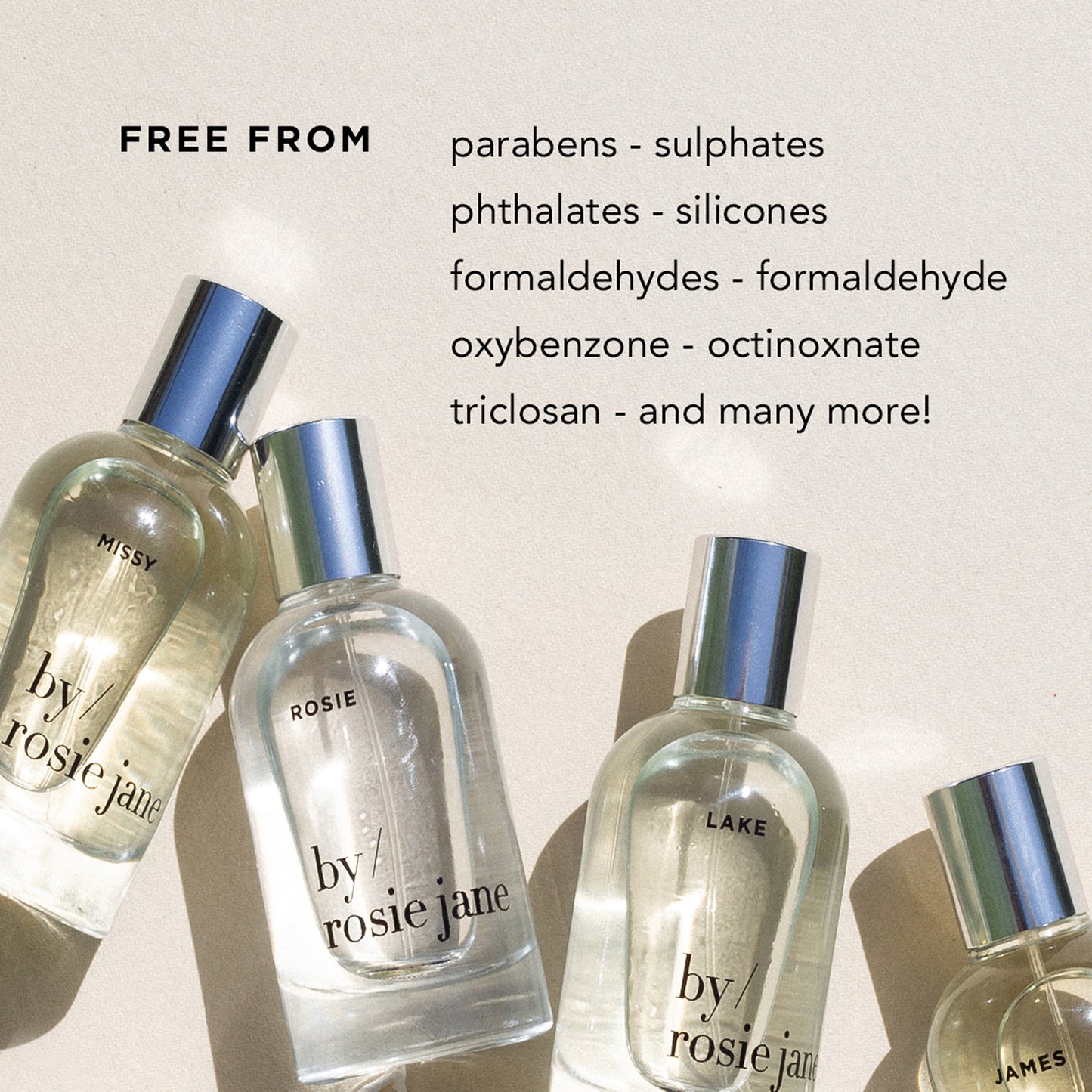 Four LAKE PERFUME OIL bottles by byrosiejane rest on a textured surface. Neroli and sandalwood notes evoke Lake Tahoe memories. Beside them: Free from parabens, sulphates, phthalates, silicones, and more!.