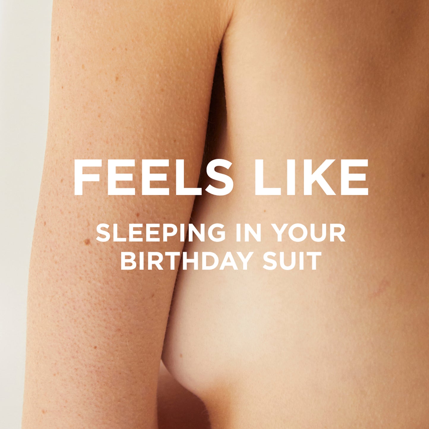 A close-up of a bare shoulder and back with the text FEELS LIKE SLEEPING IN YOUR BIRTHDAY SUIT, capturing the essence of byrosiejane’s ROSIE LAST ALL DAY SET perfume oil.