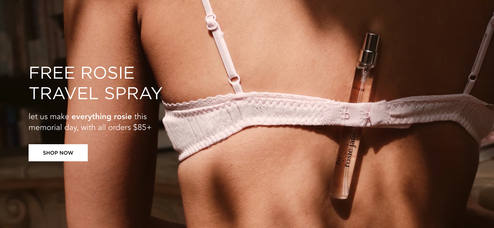 rosie travel spray tucked into the back of a bra