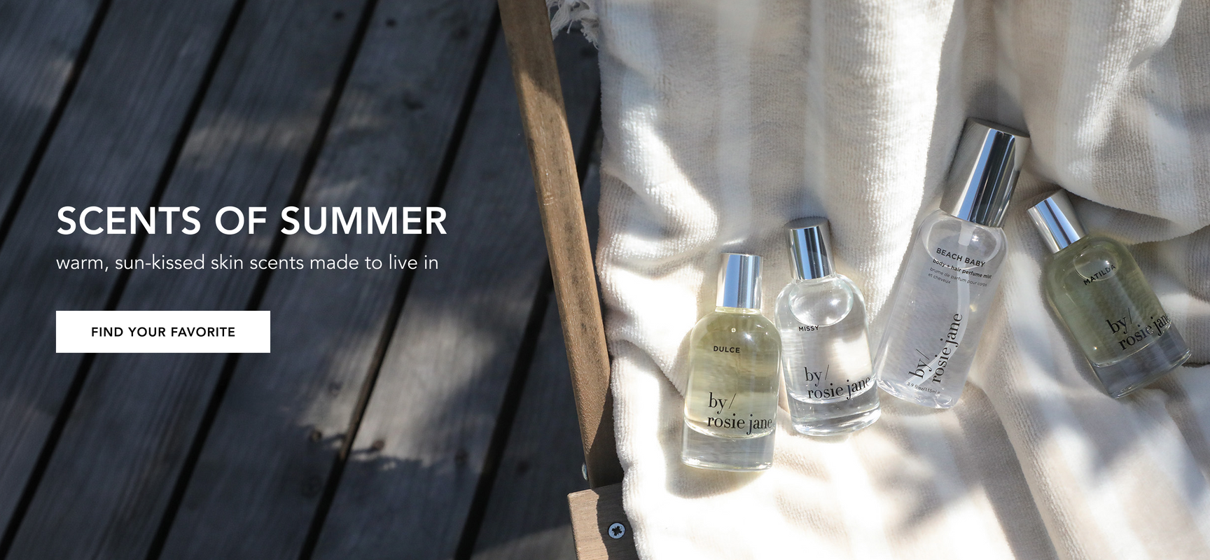 dulce perfume, missy perfume, beach baby body mist, and matilda perfume on a towel, sitting on a chair.
