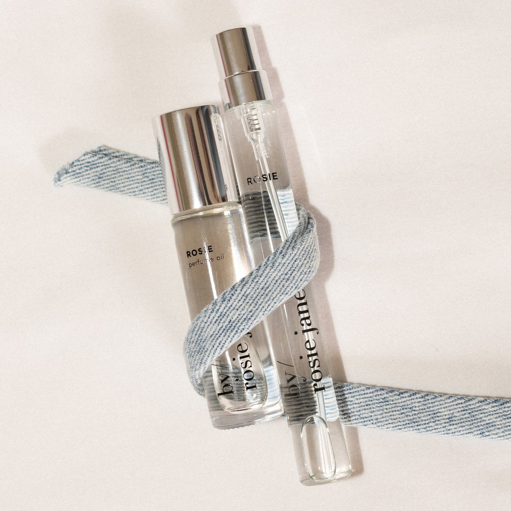 perfume oil and travel spray with a ribbon