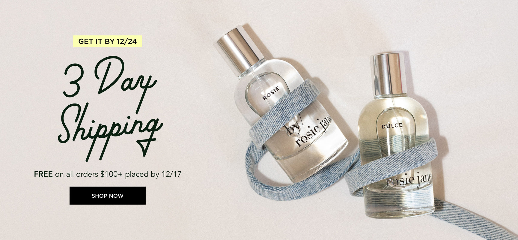 rosie and dulce perfume with denim ribbon on white background