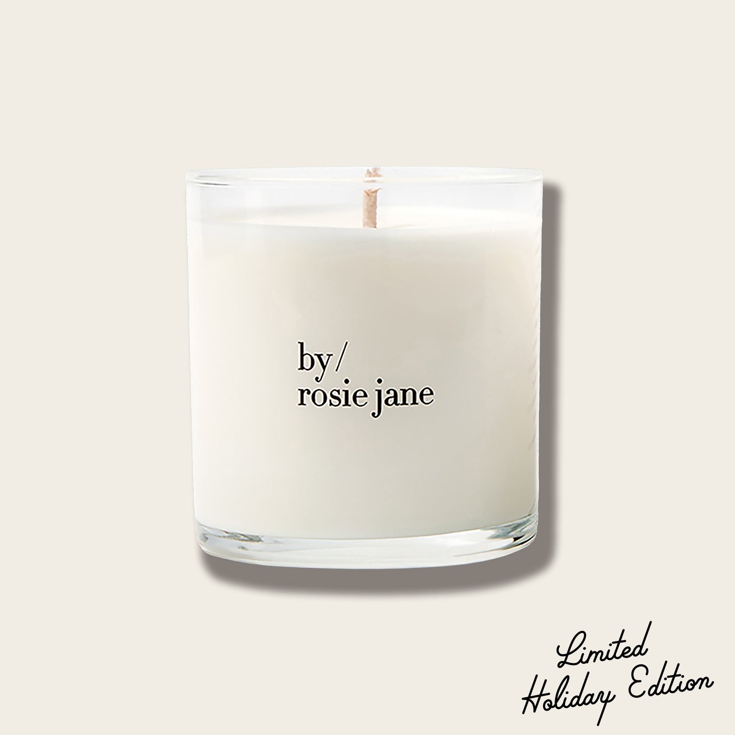 Candle with 'by rosie jane' text on a light background and 'limited holiday edition' writing