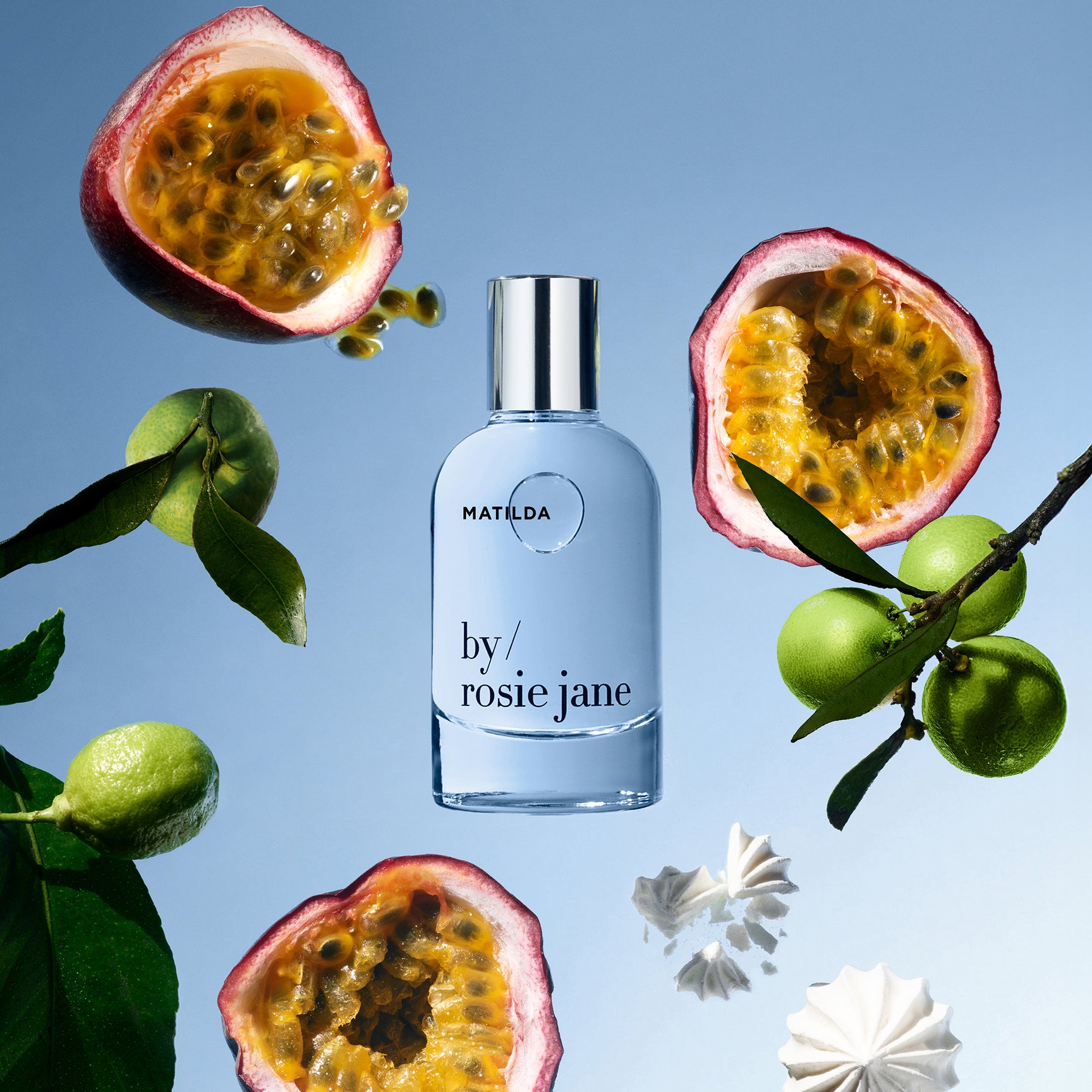 MATILDA Perfume bottle labeled 'by rosie jane' surrounded by passion fruits and leaves on a blue background