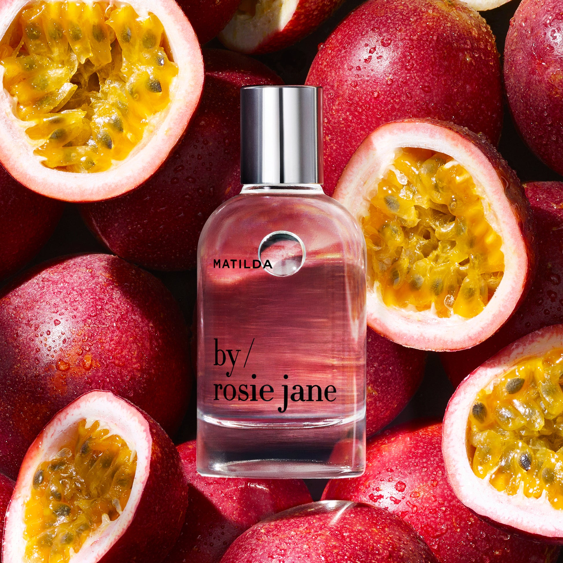 MATILDA Perfume bottle by Rosie Jane surrounded by passion fruits