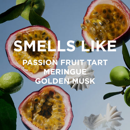Passion fruit halves with leaves and whipped cream on a blue background, text 'SMELS LIKE PASSION FRUIT TART MERINGUE GOLDEN MUSK'.