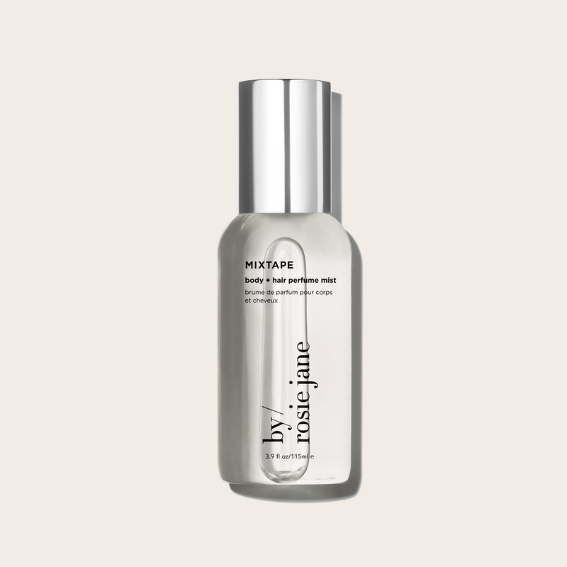 Bottle of 'mixtape' body hair perfume mist by rosie jane on a light beige background