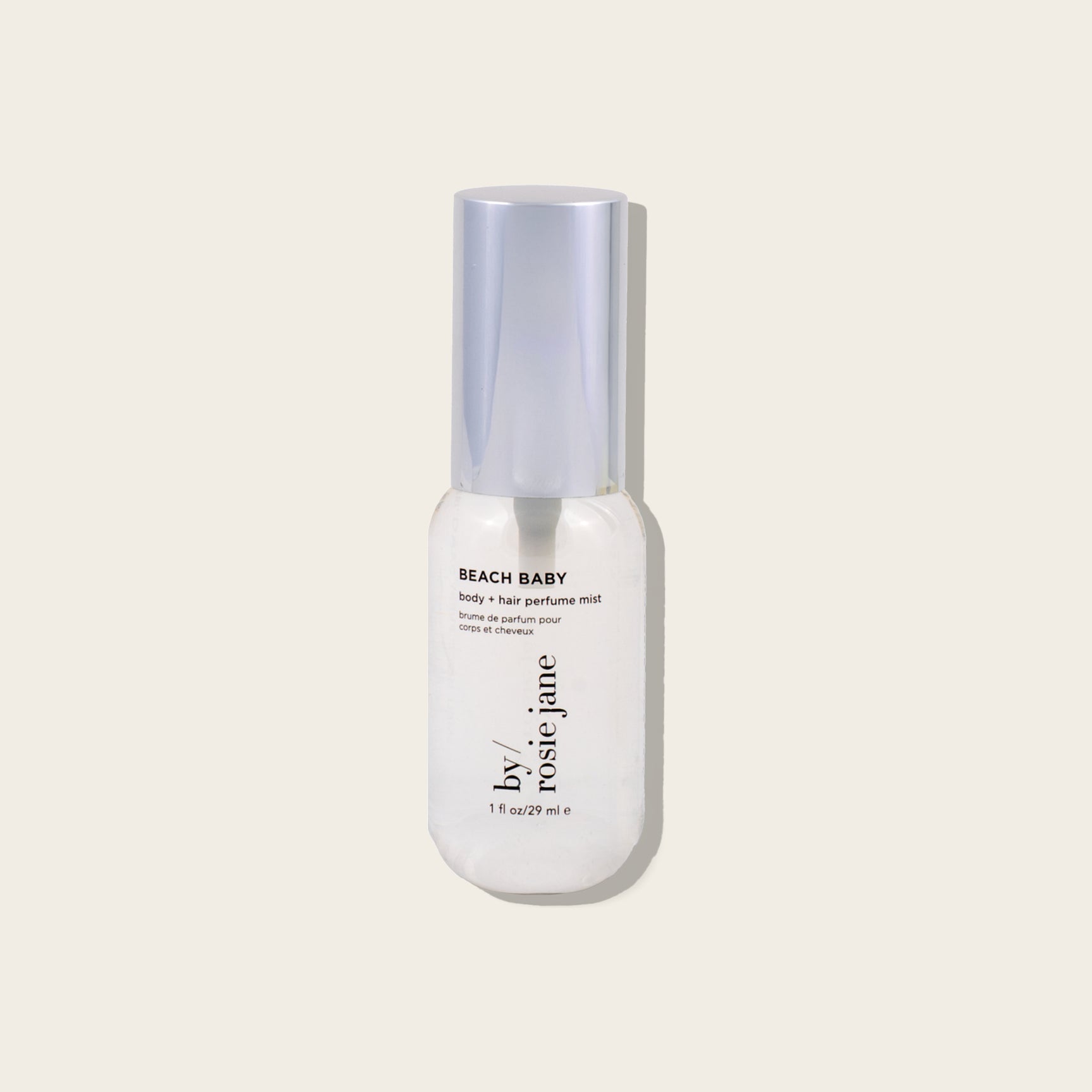 mini bottle labeled 'Birthday Suit' by Rosie Jane on a light beige background