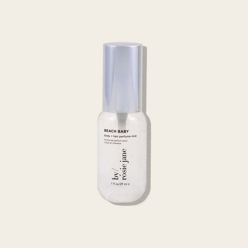 mini bottle labeled 'Birthday Suit' by Rosie Jane on a light beige background