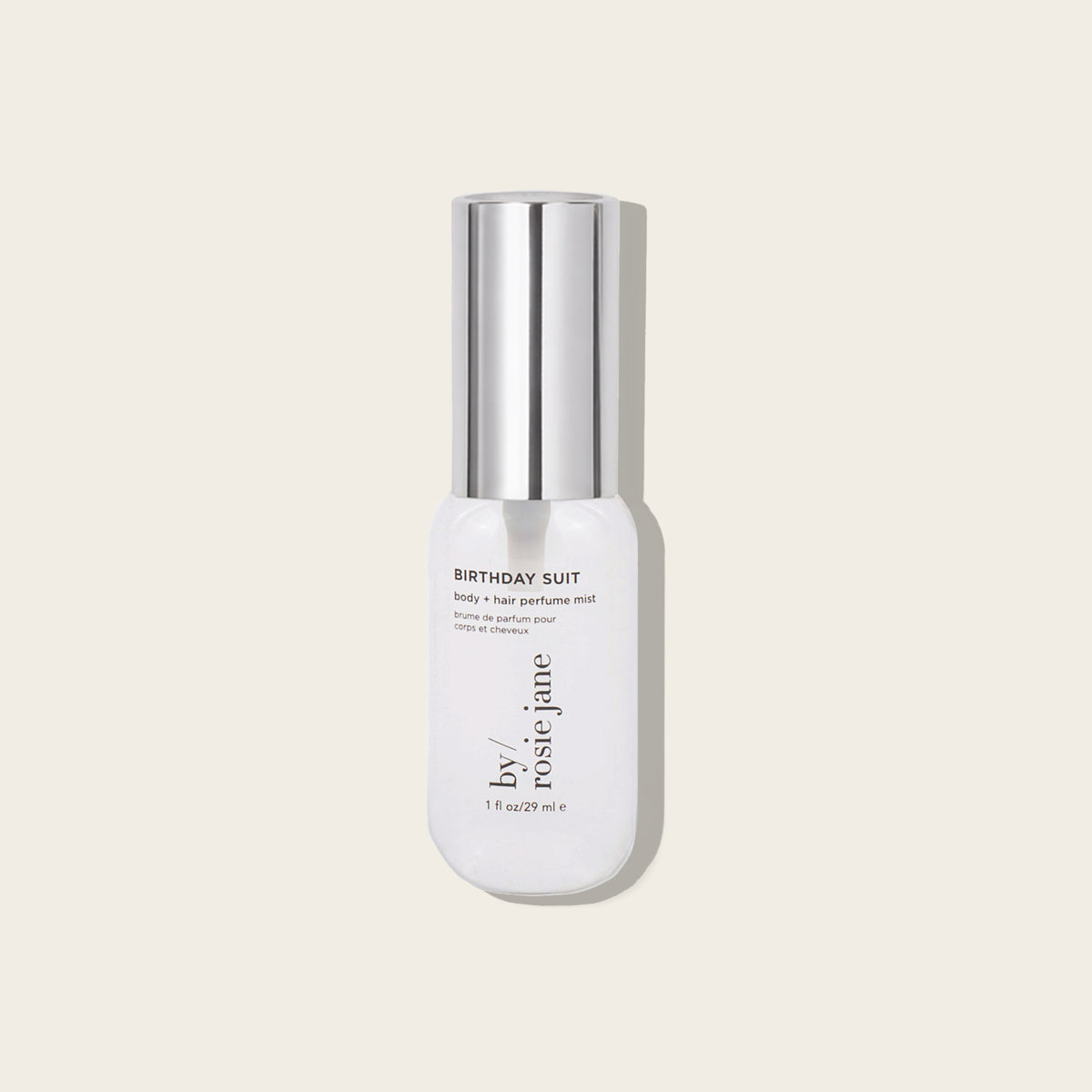 mini bottle labeled 'Birthday Suit' by Rosie Jane on a light beige background