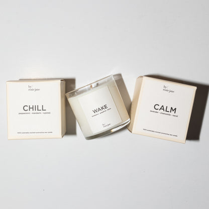 3 candles on a white background. they come in boxes.