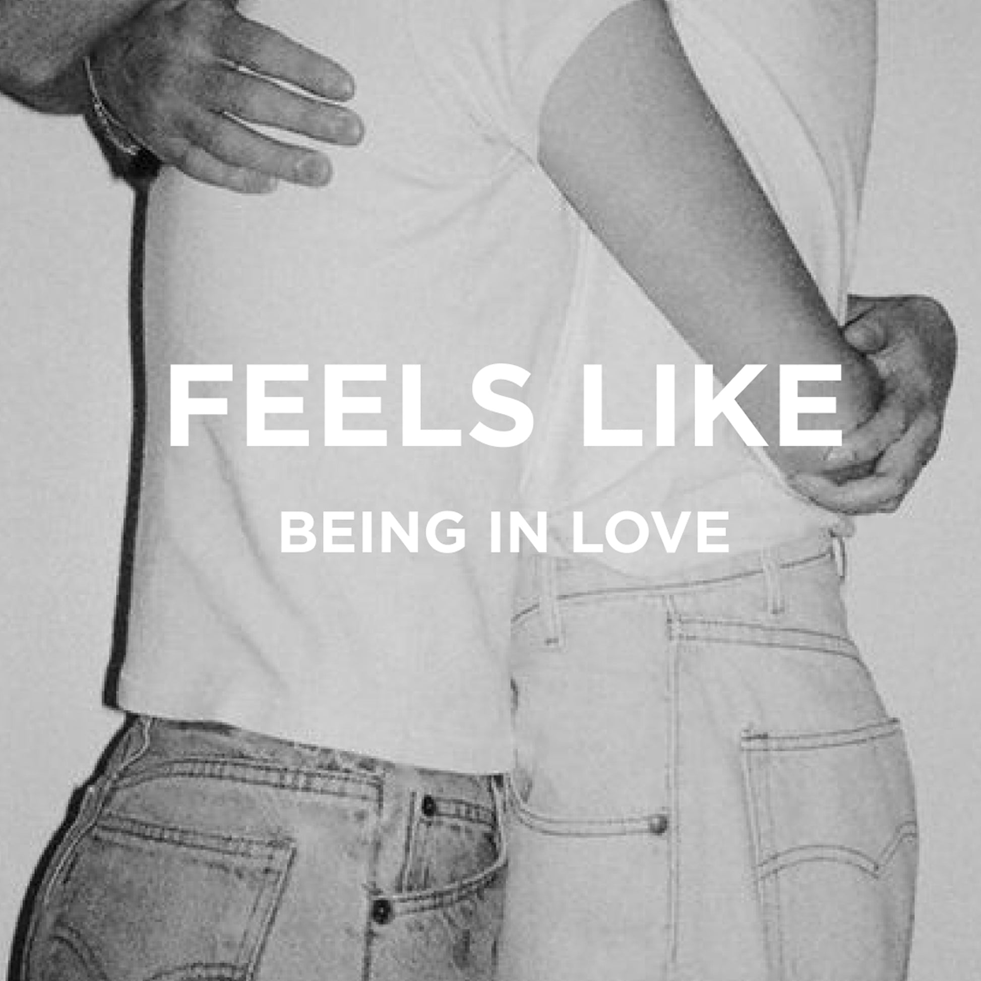 Black and white photo of two people hugging in light shirts and jeans. Overlaid text: FEELS LIKE BEING IN LOVE—with the DYLAN LAST ALL DAY SET by byrosiejane, a long lasting fragrance as unforgettable as this moment.