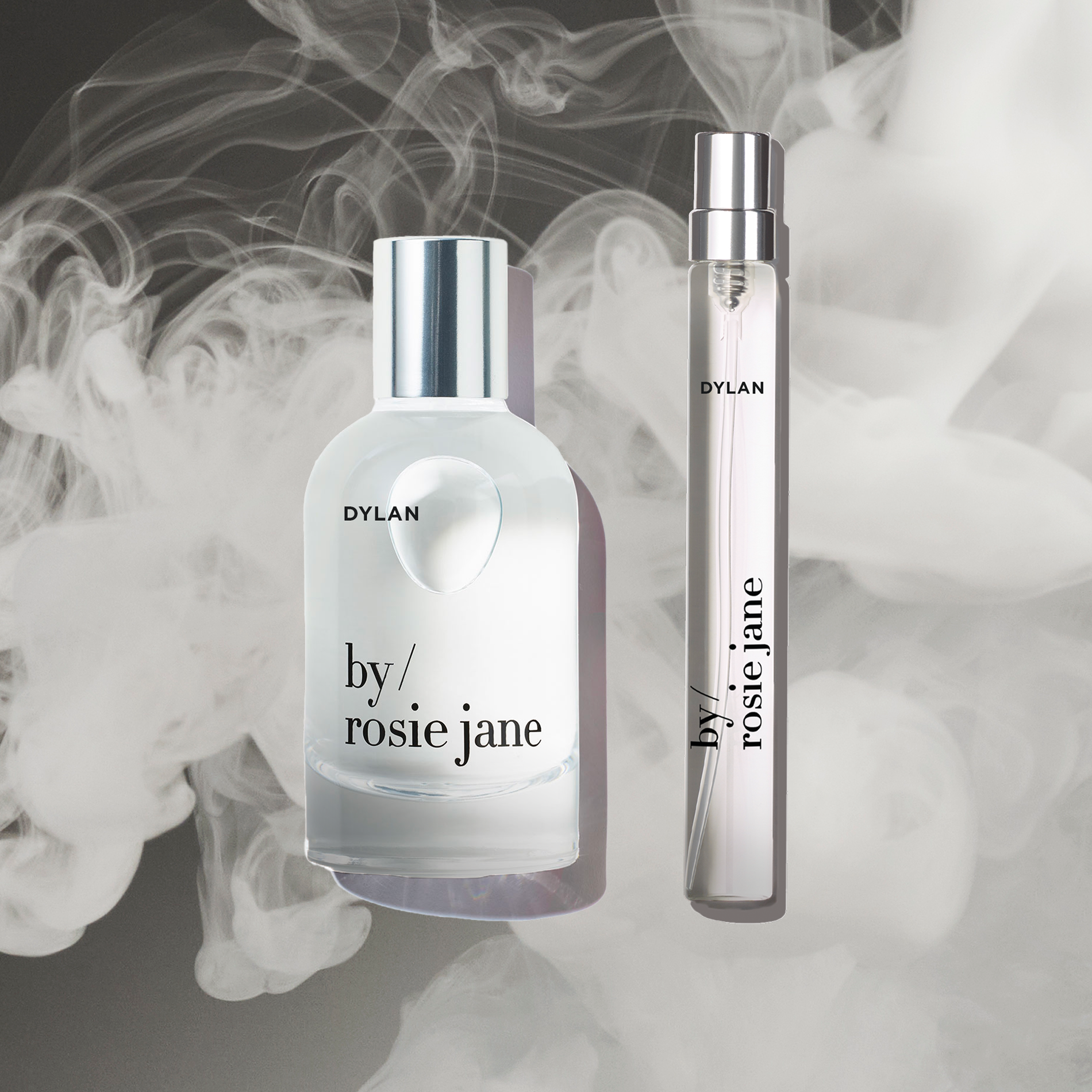Two perfume bottles labeled 'by rosie jane' with smoke effect in the background