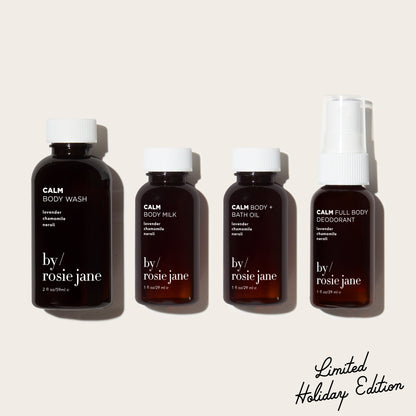 Four mini bottles of 'by rosie jane' calm skincare products on a beige background