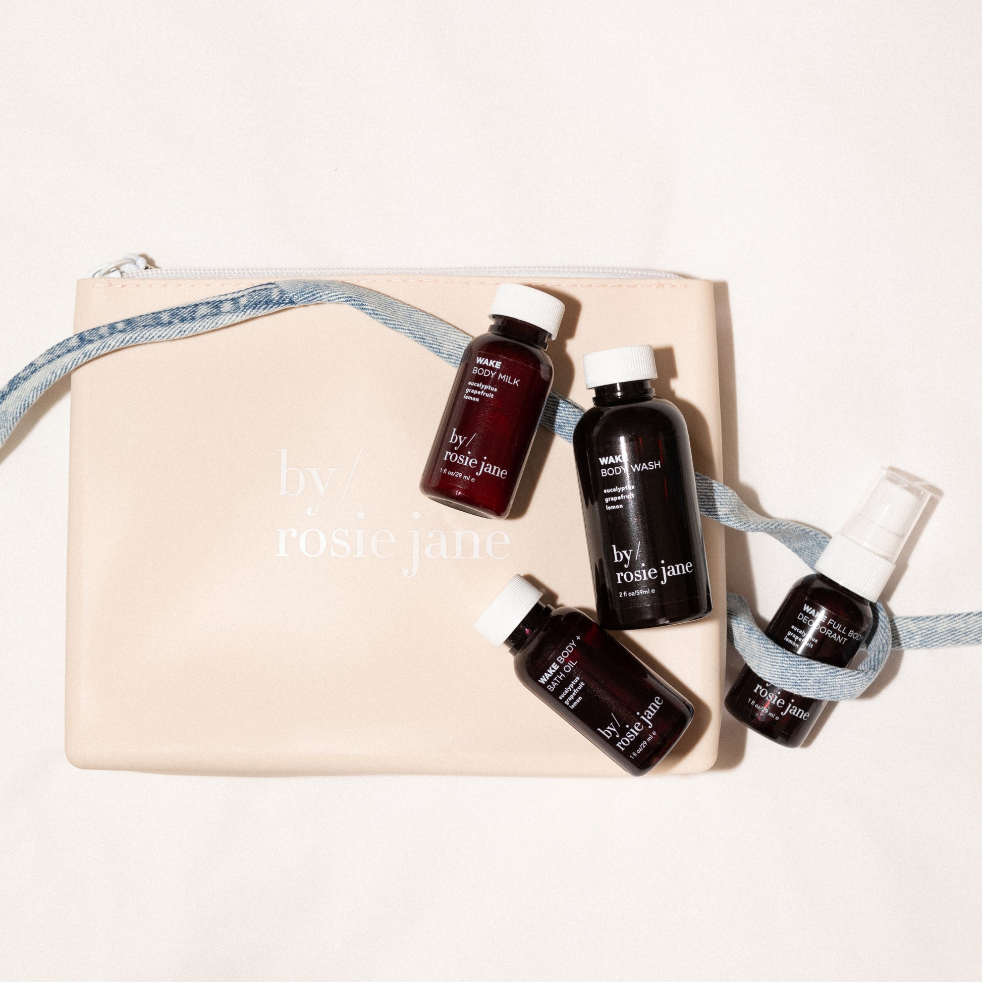 Set of mini skincare products by rosie jane on a beige pouch 