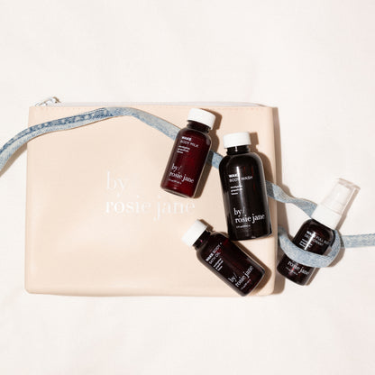 Set of mini skincare products by rosie jane on a beige pouch 