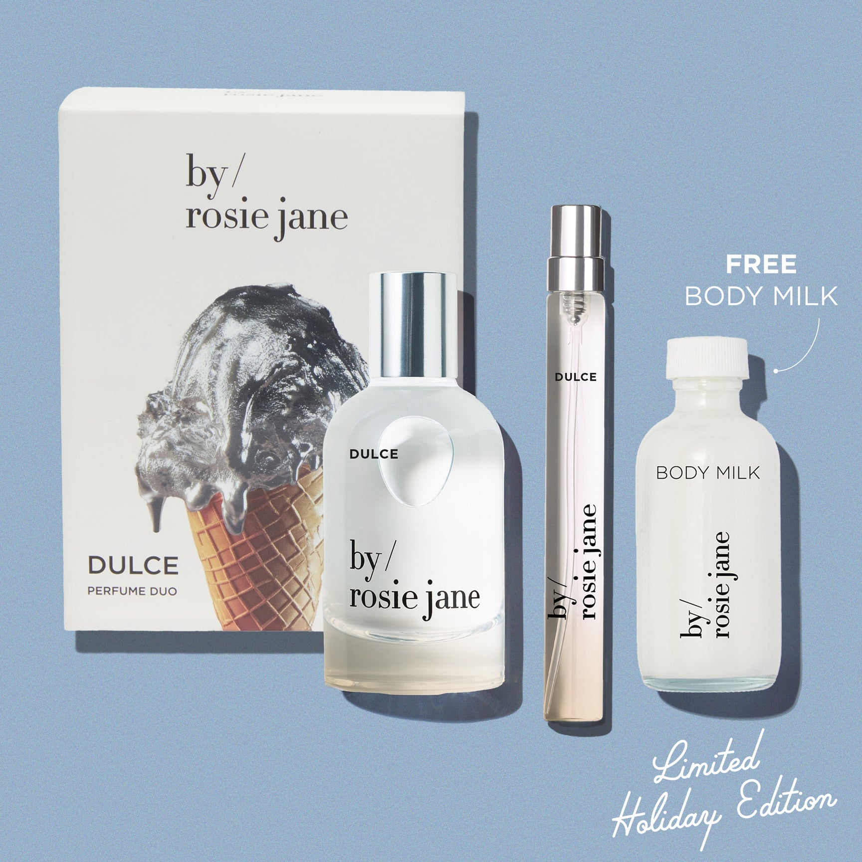 By Rosie Jane DULCE perfume set with packaging and bottles on a blue background