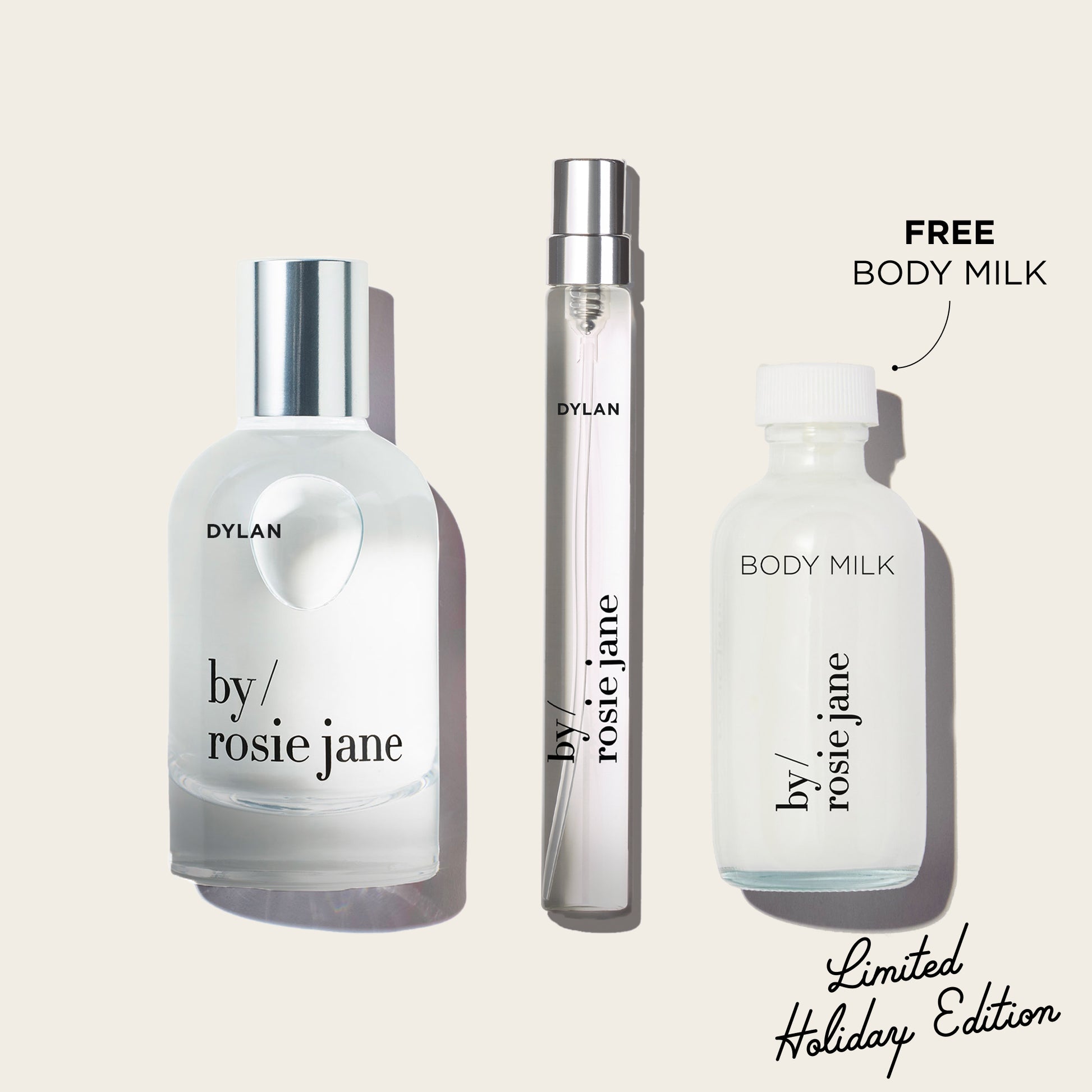 Three bottles of 'by rosie jane' and 'Dylan' on a light beige background with text indicating free body milk and limited holiday edition.