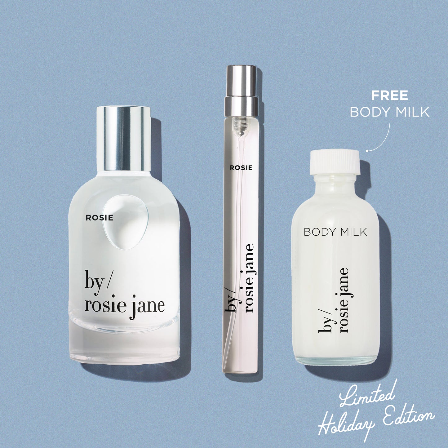 Three ROSIE 'by Rosie Jane' products on a blue background with 'Free Body Milk' text.