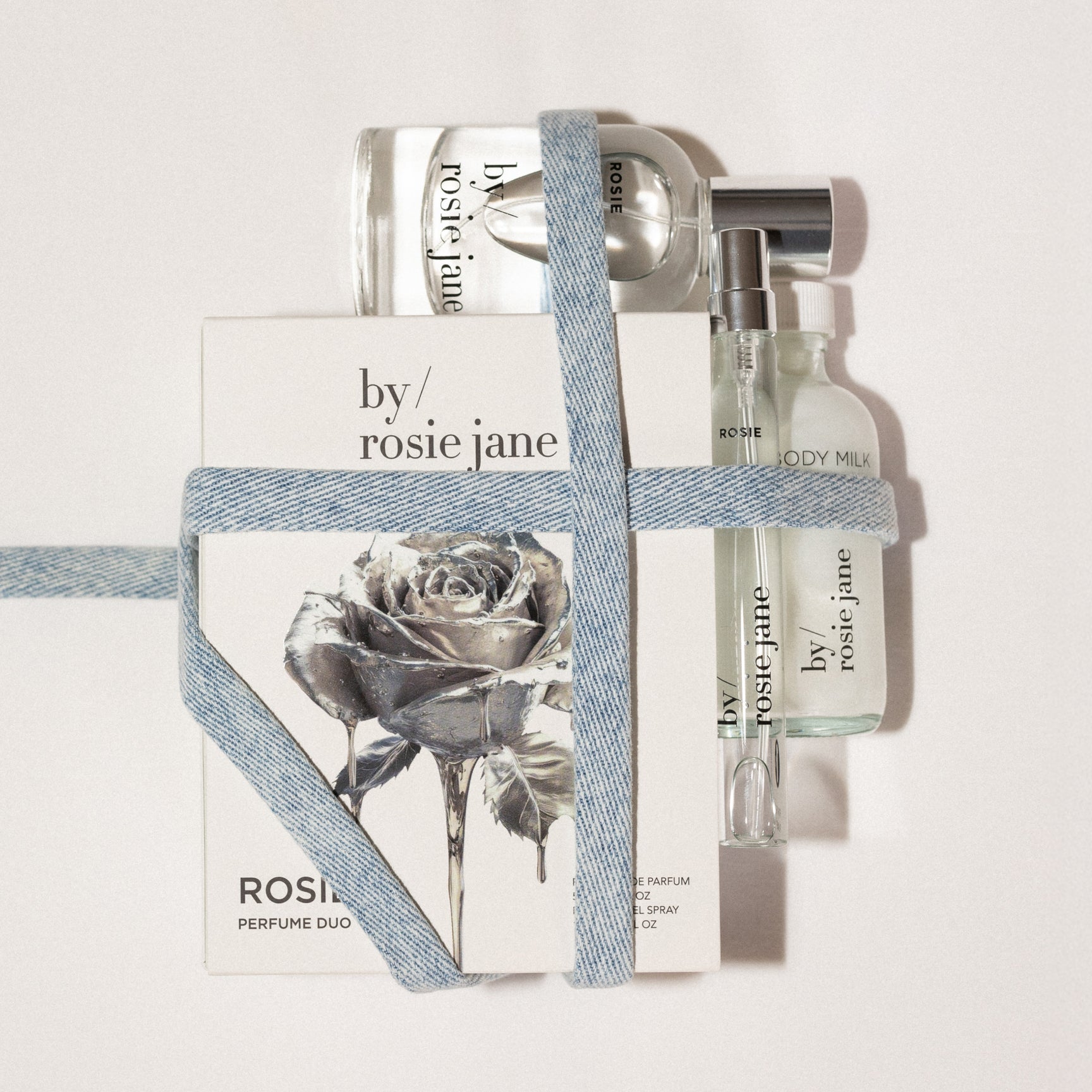 Rosie Jane perfume ROSIE duo with a rose design on packaging against a light background