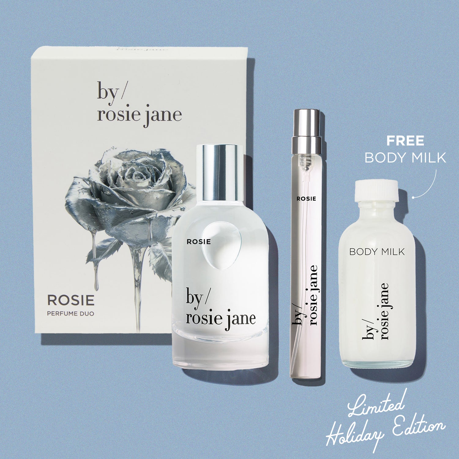 By Rosie Jane rosie perfume set with packaging and bottles on a light blue background