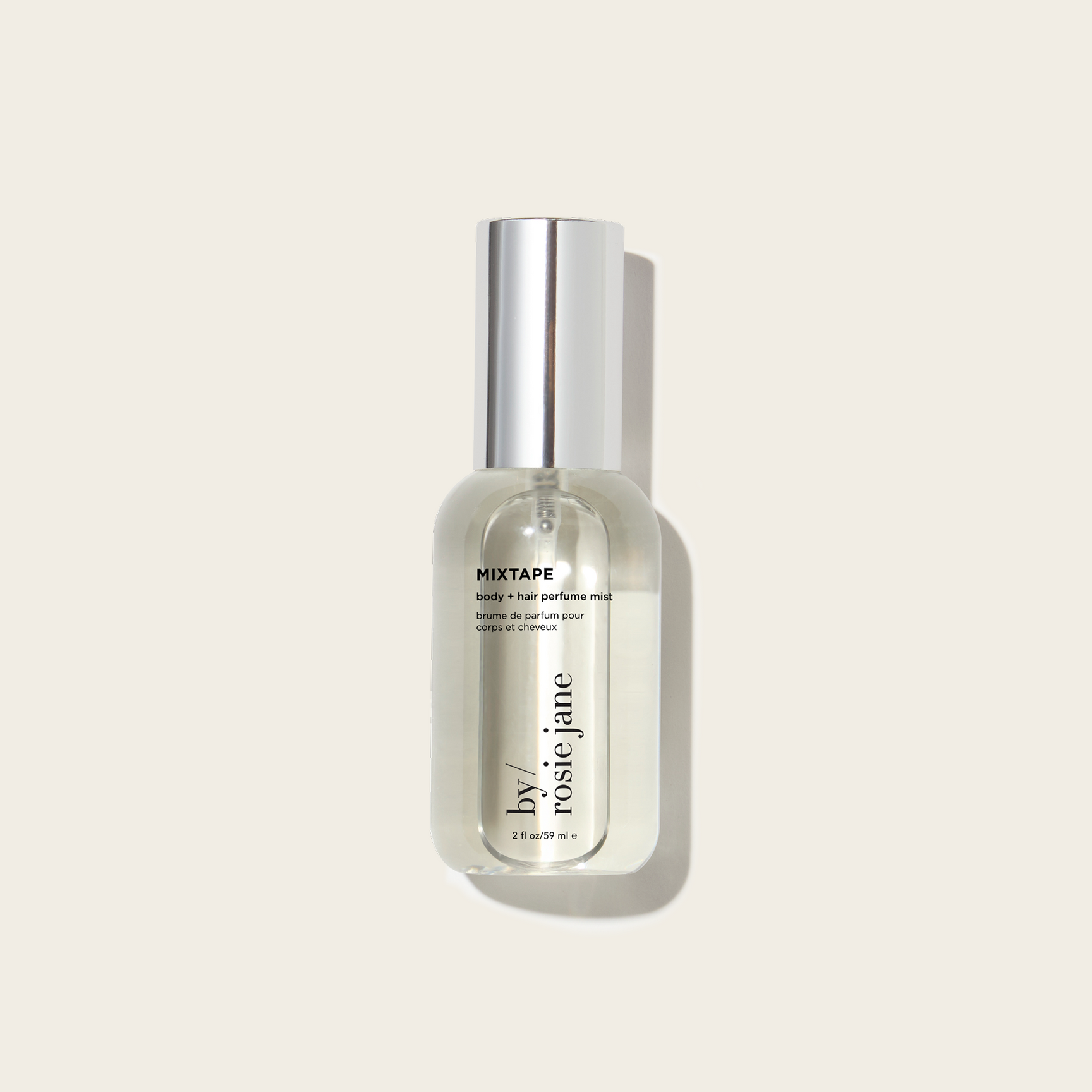 Perfume bottle labeled 'MIXTAPE' by Rosie Jane on a light beige background