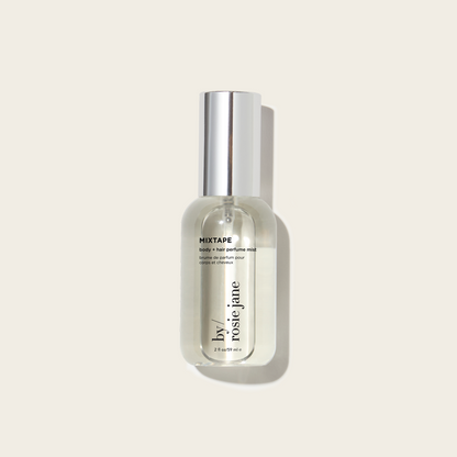 Perfume bottle labeled 'MIXTAPE' by Rosie Jane on a light beige background