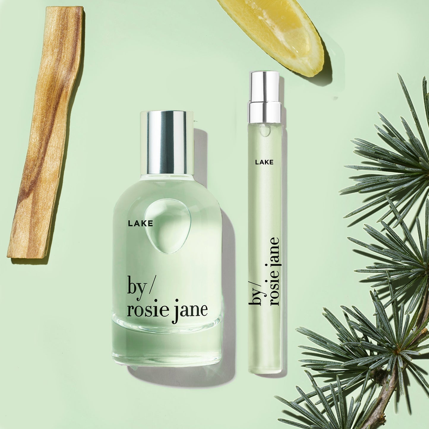 Lake Home + Away Set with 50ml and 10ml Eau de Parfum bottles, surrounded by a lemon slice, embodying fall and Lake Tahoe's essence.