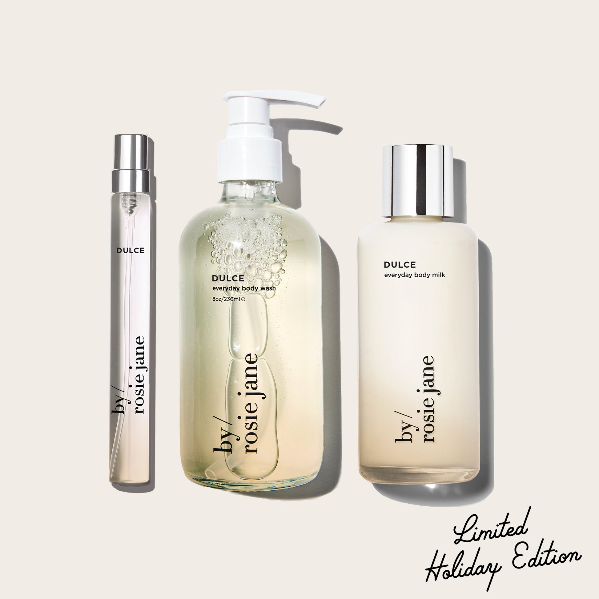 three DULCE products, body wash, body milk, and a travel spray by 'by rosie jane' on a light beige background with 'Limited Holiday Edition' text.