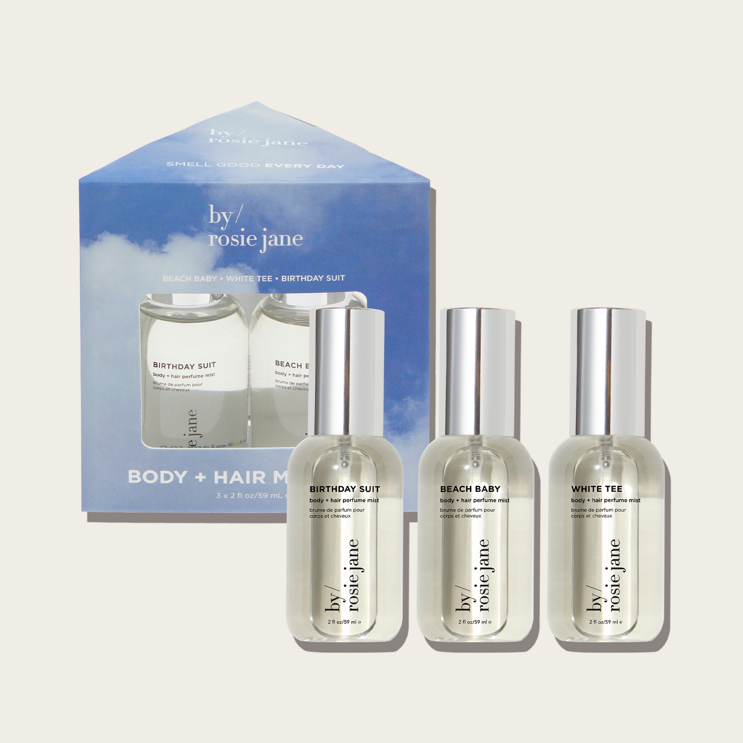 Set of body mist bottles by rosie jane with a branded box on a light gray background