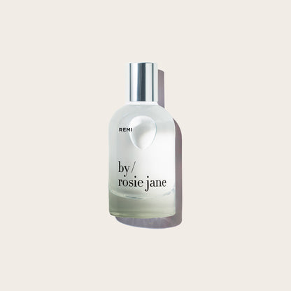 REMI perfume bottle on light background
