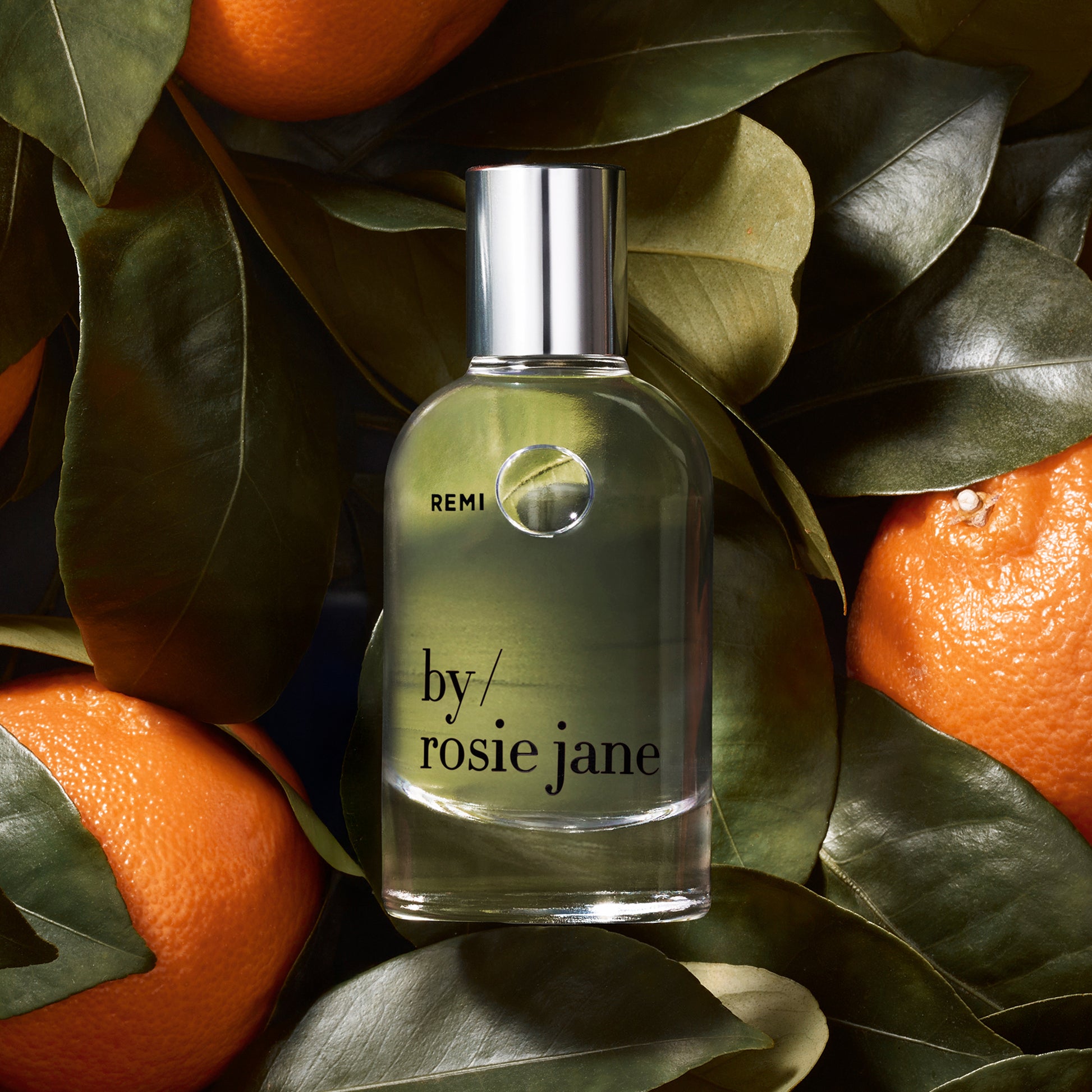 REMI bottle on background of mandarins