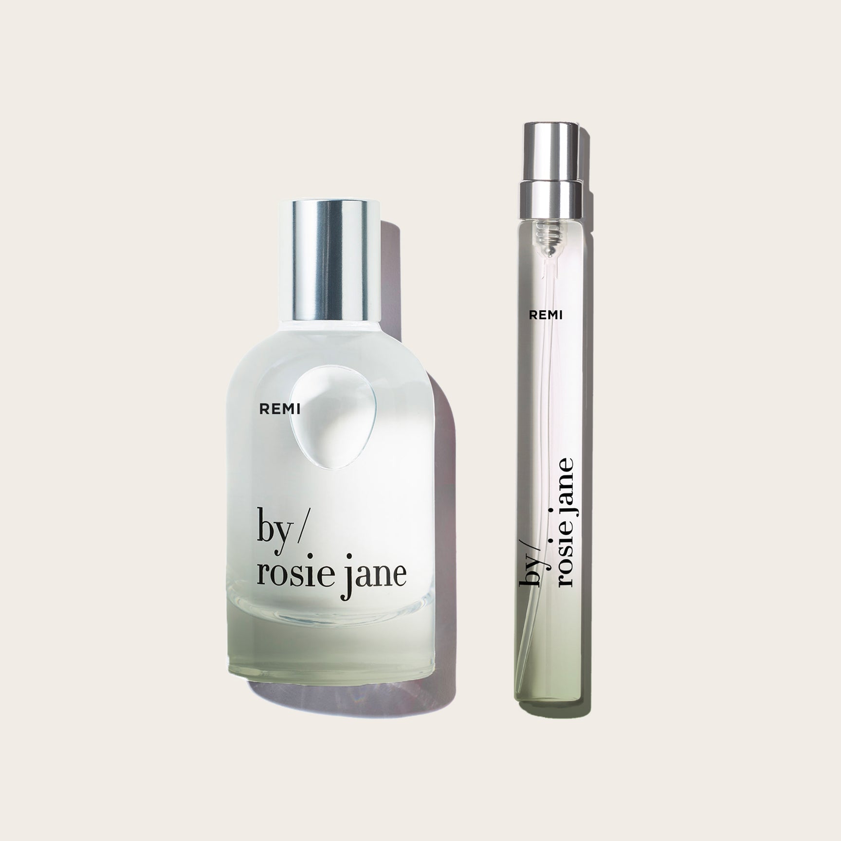remi edp and travel spray on a tan background 