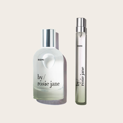 remi edp and travel spray on a tan background 