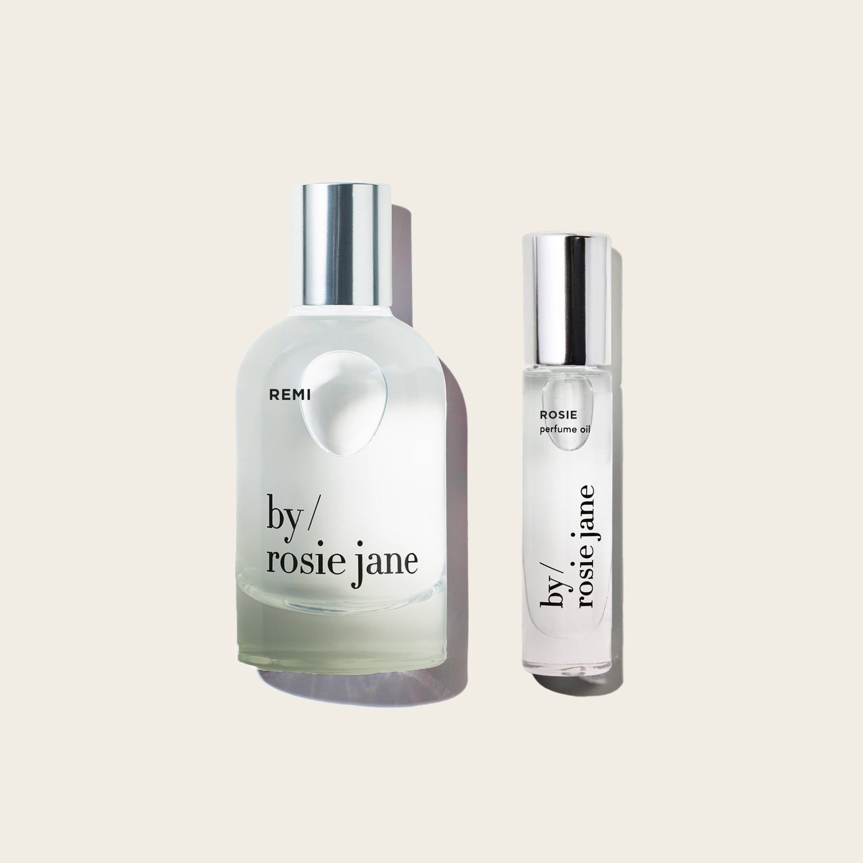 remi edp and rosie perfume oil on tan background