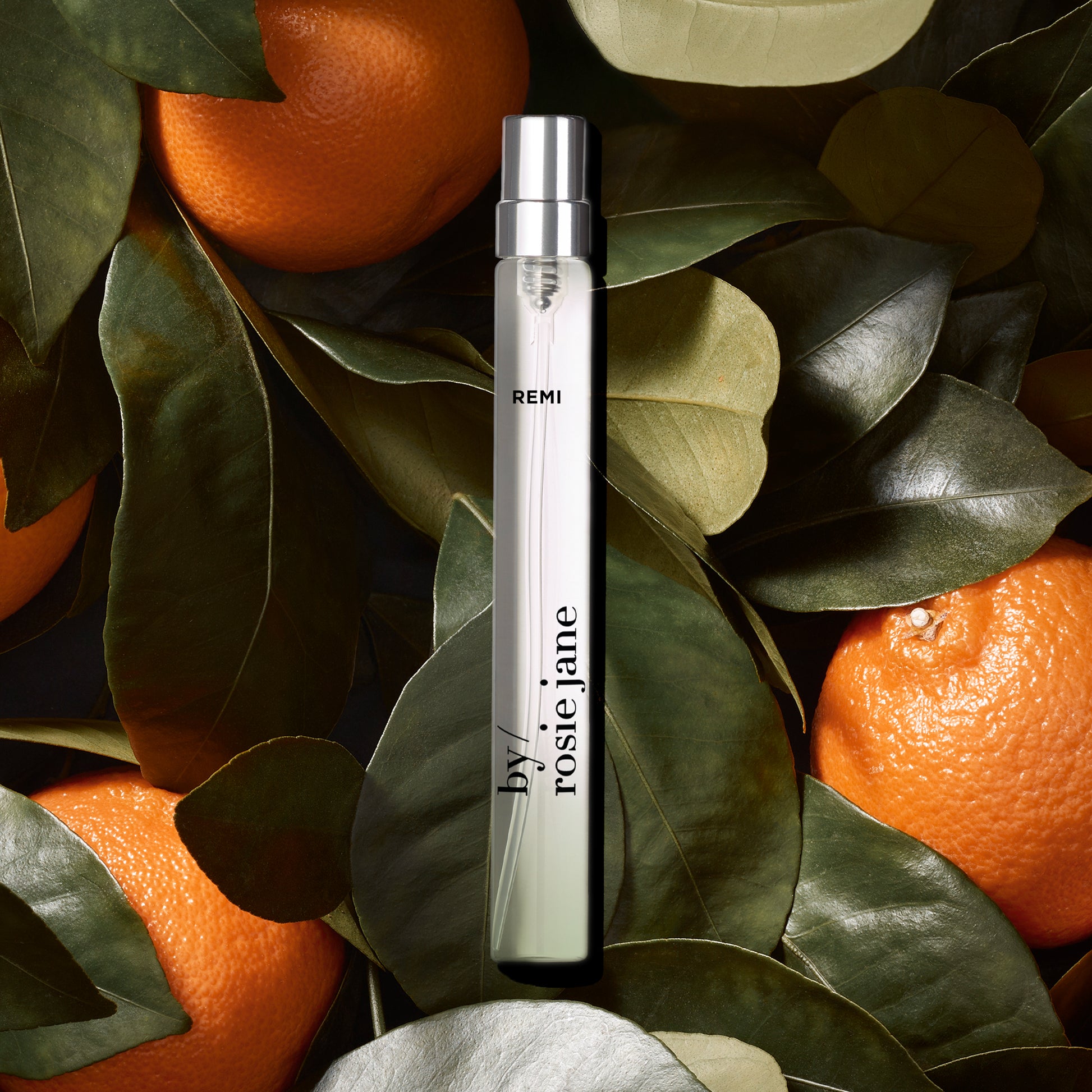 REMI travel spray on mandarin background