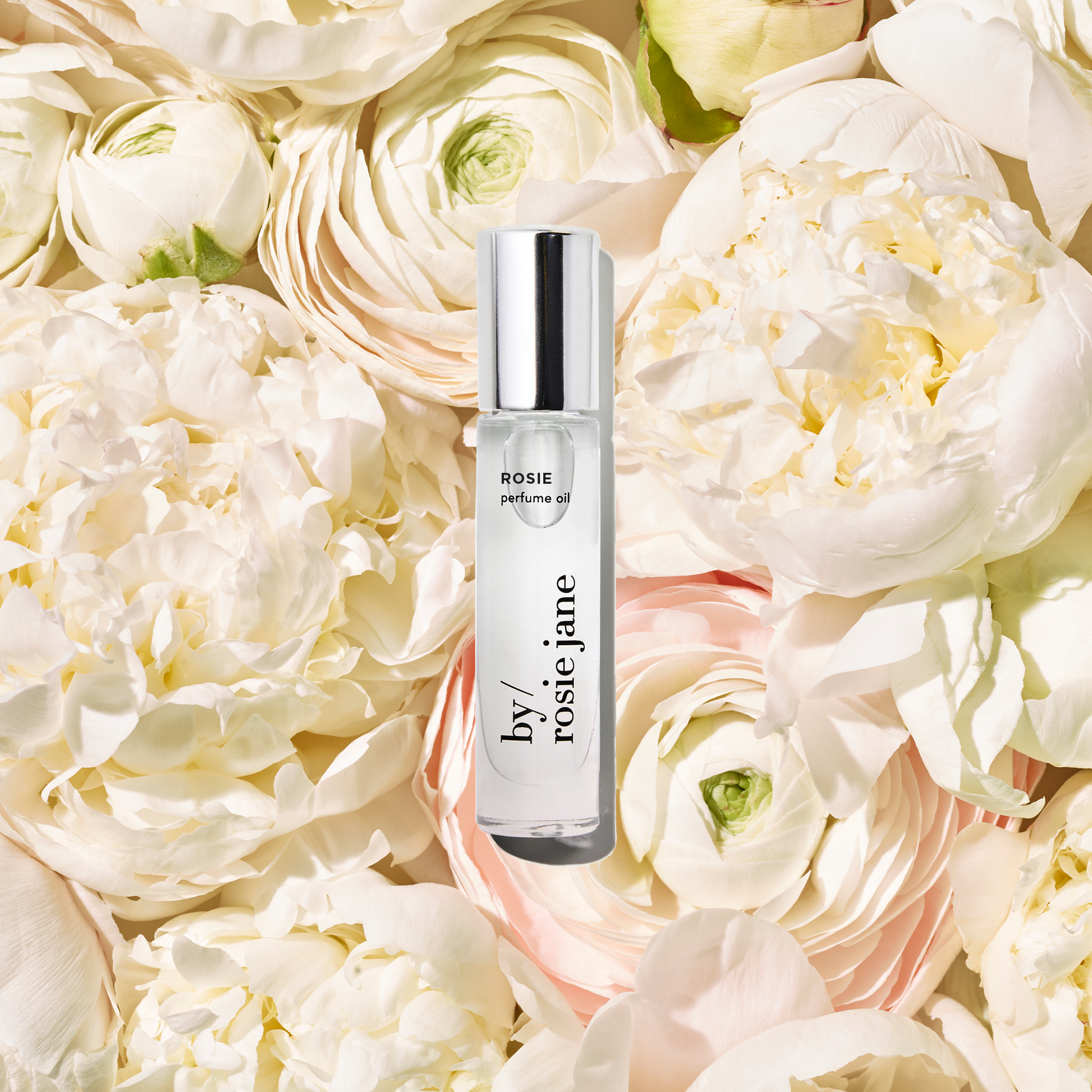 Rosie perfume oil on roses 