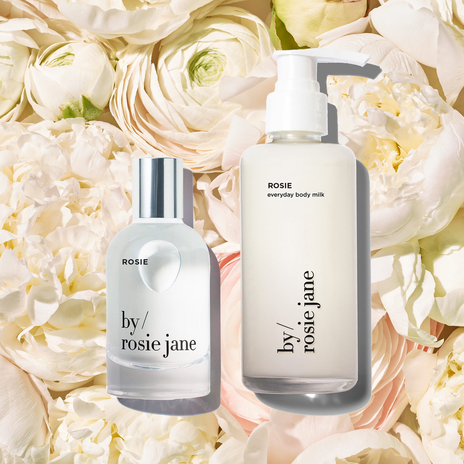 Two ROSIE skincare products from 'by rosie jane' on a bed of white flowers