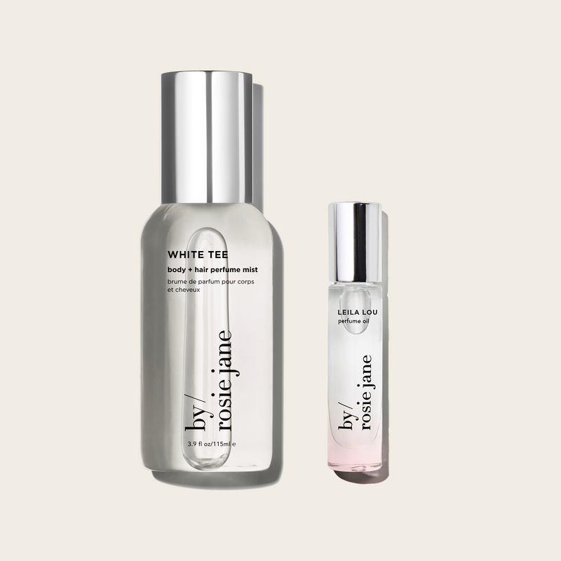 white tee body mist and leila lou perfume oil from 'by rosie jane' on a light beige background