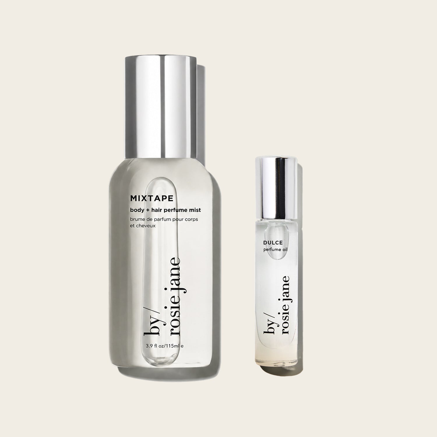 Two clear cosmetic bottles with silver caps on a light warm gray background: a larger bottle labeled MIXTAPE body + hair perfume mist and a smaller bottle labeled DULCE perfume oil, both from by rosie jane.