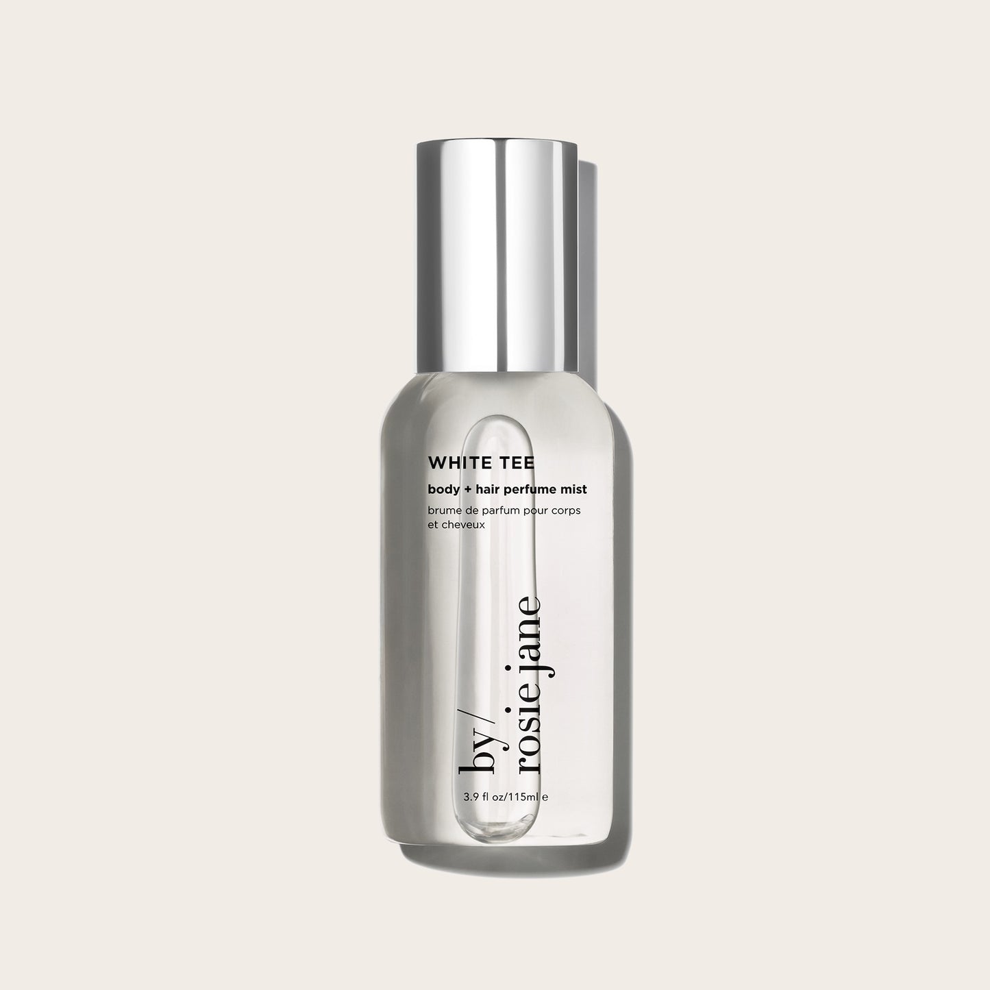 white tee body mist on a tan background
