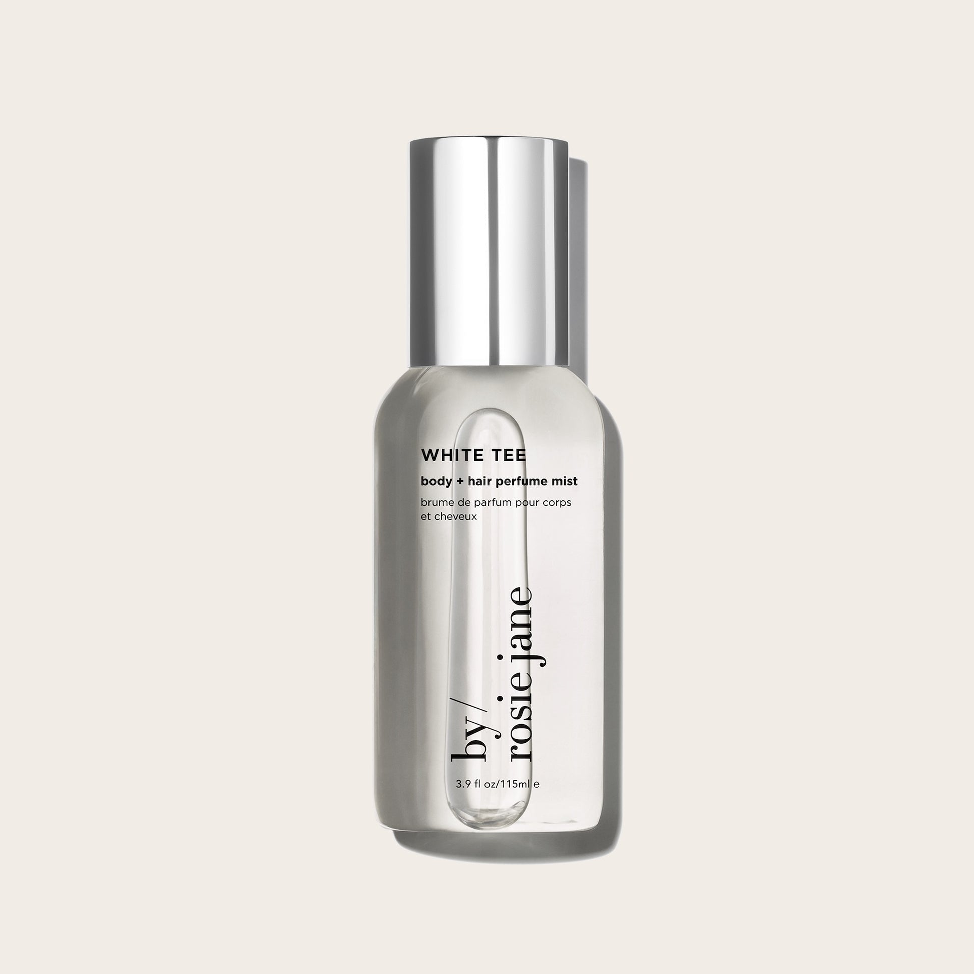white tee body mist on a tan background