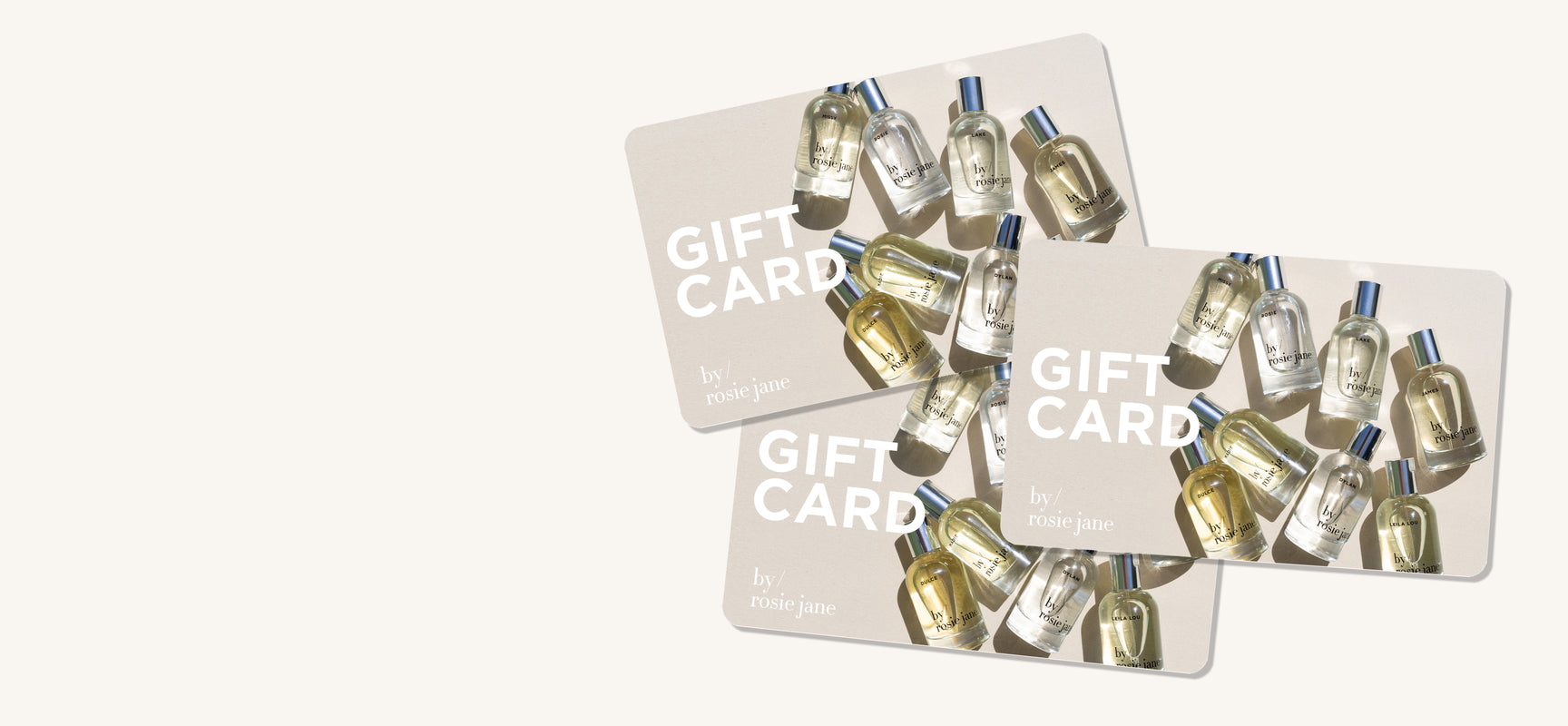 three by/ rosie jane gift cards laying on top of each other