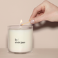 a person lighting a by/ rosie jane candle.