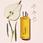 leila lou body oil with notes: pear, jasmine, and fresh cut grass.