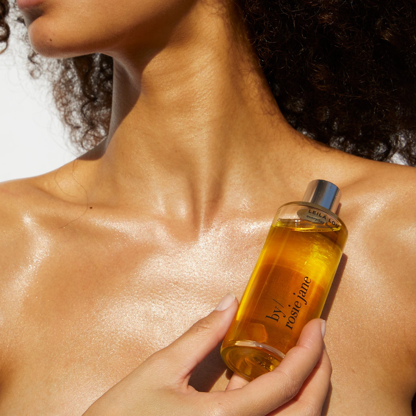 dulce body oil with model