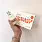 fragrance discovery set with perfume in hand